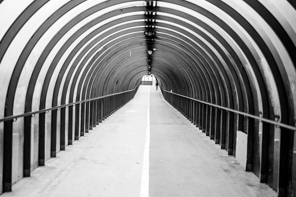 Actually, this isn't strictly a bridge over the river. Its the (covered) walkway going from the railway station back to the river. It is a bridge though, and I like the image so much decided also to feature it for the post.