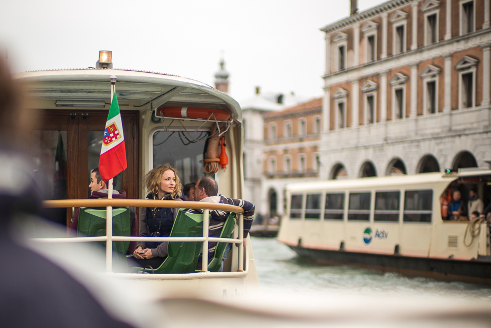 The Vaporetto along the Grand Canal, Venice, taken from a water taxi, just behind the taxi's "driver". A moment later she turned and smiled (my heart melted!), but I liked this photo of her better.