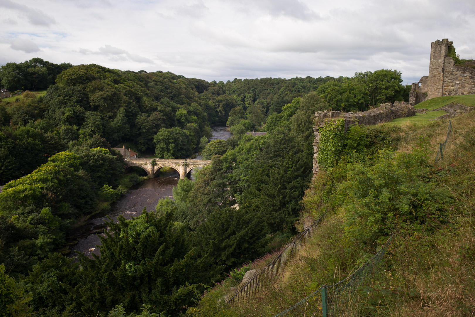 The castle uses the river on one side as a natural barrier, and the cliff falls steeply.