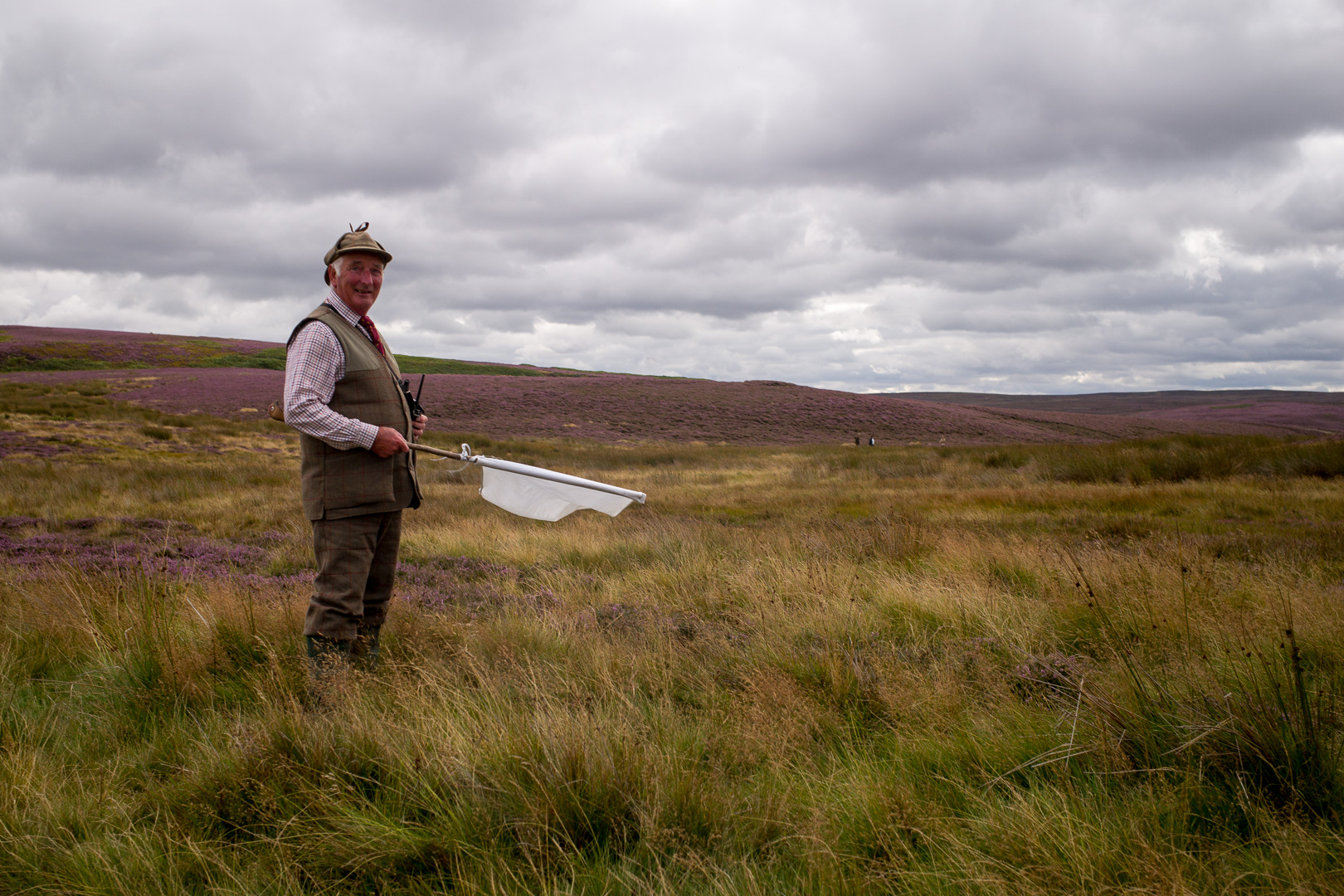 Its Grouse season, and this kind gentleman is ensuring us walkers don't stray too close to the carnage occurring in the background.